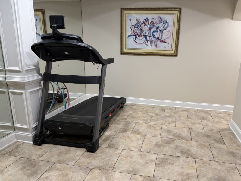 Full basement with 1 queen size bed, kitchenette, workout room with treadmill, family room with pool table.