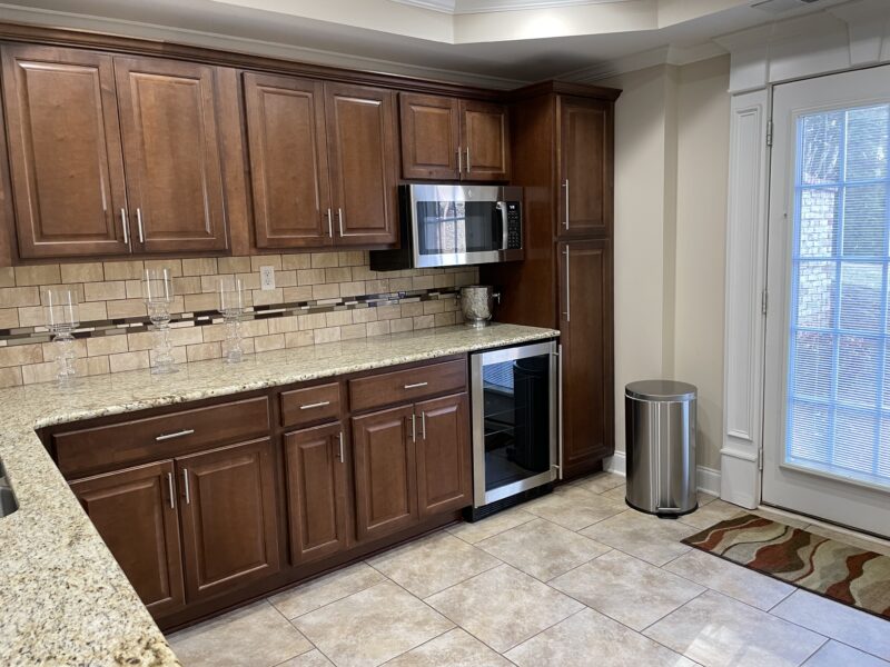 Full basement with 1 queen size bed, kitchenette, workout room with treadmill, family room with pool table.