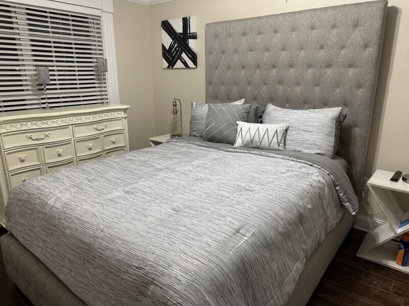 Full basement with 1 queen size bed, kitchenette, workout room with treadmill, family room with pool table.